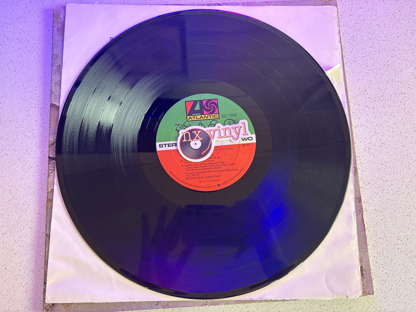 Vinyl record with a label on a textured surface