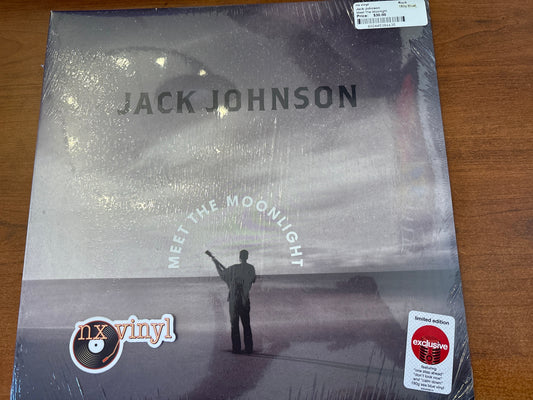 Vinyl record cover for 'Meet the Moonlight' by Jack Johnson on a wooden surface